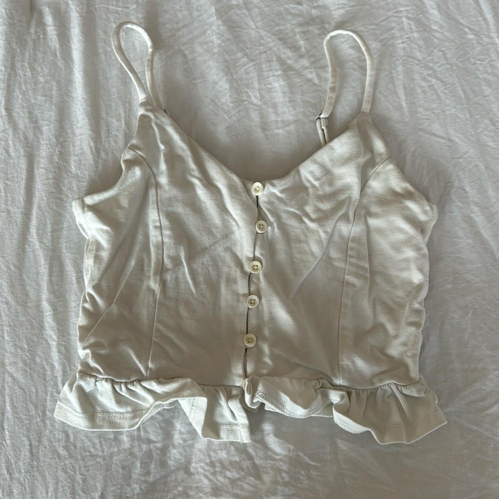 White button-down ruffled crop tank